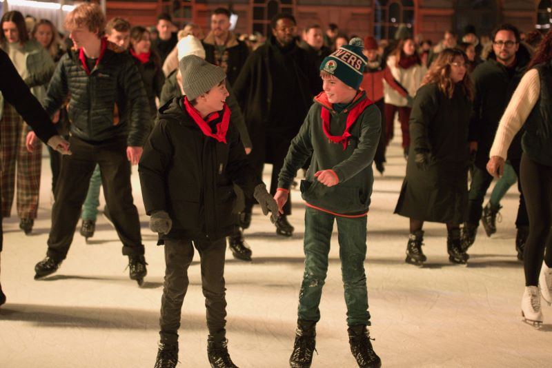A picture of two scouts ice skating